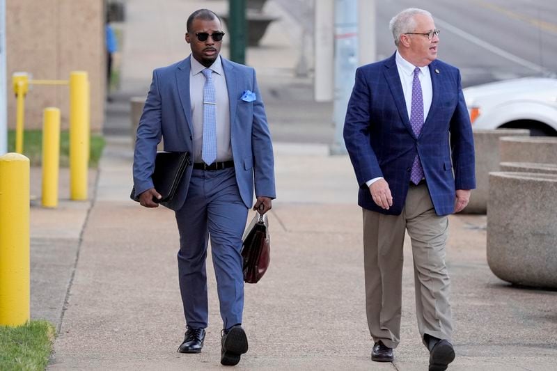 Former Memphis police officer Justin Smith, left, and attorney Martin Zummach, right, arrive at the federal courthouse for the second day of jury selection for the trial in the Tyre Nichols case Tuesday, Sept. 10, 2024, in Memphis, Tenn. (AP Photo/George Walker IV)