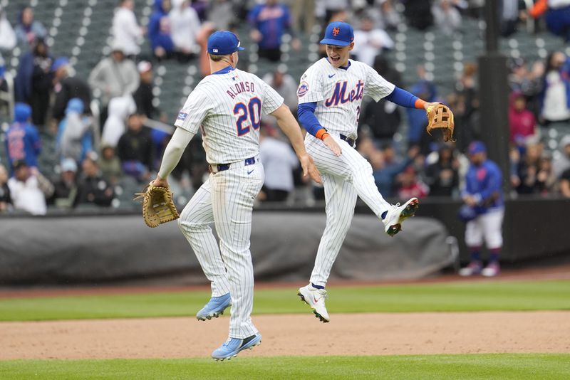 New York Mets' Pete Alonso (20) and Zack Short celebrate after the Mets defeated the Pittsburgh Pirates in a baseball game, Wednesday, April 17, 2024, in New York. (AP Photo/Mary Altaffer)