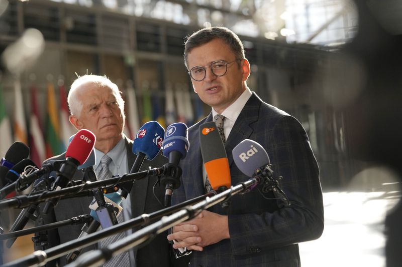 European Union foreign policy chief Josep Borrell, left, and Ukraine's Foreign Minister Dmytro Kuleba speak with the media as they arrive for a meeting of EU foreign ministers at the European Council building in Brussels, Thursday, Aug. 29, 2024. (AP Photo/Virginia Mayo)