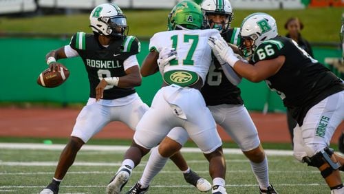 Roswell’s quarterback, Trey Smith, passes the ball during the Buford at Roswell high school football game in Roswell, Georgia on September 6, 2024. (Jamie Spaar for the Atlanta Journal Constitution)