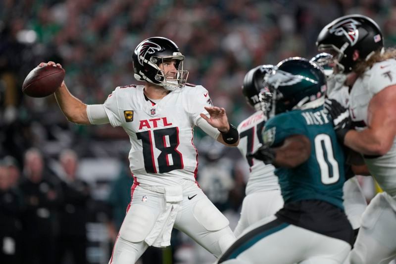 Atlanta Falcons quarterback Kirk Cousins (18) looks to pass during the first half of an NFL football game against the Philadelphia Eagles on Monday, Sept. 16, 2024, in Philadelphia. (AP Photo/Matt Rourke)