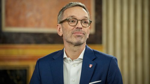 Herbert Kickl, leader of the Freedom Party of Austria smiles at the national broadcaster studio, set up in the parliament building, in Vienna, Austria, Sunday, Sept. 29, 2024, after polls closed in the country's national election. (AP Photo/Andreea Alexandru)