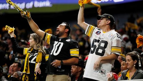 Steelers fans cheer their team defeated the falcons 19-16 at Mercedes-Benz Stadium on Sunday, December 4, 2022. (Miguel Martinez / miguel.martinezjimenez@ajc.com)