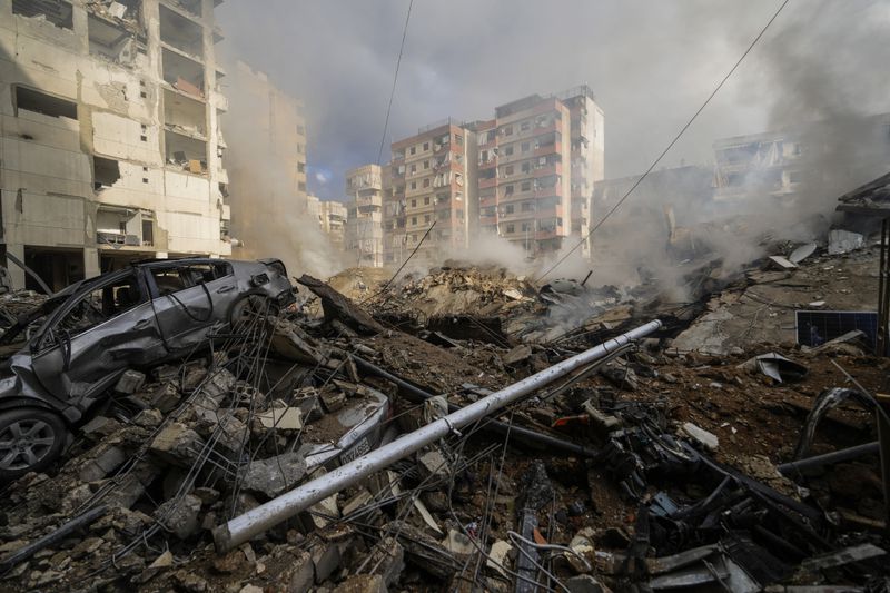 Smoke rises from the site of an Israeli airstrike in Beirut's southern suburb, Lebanon, Tuesday, Oct. 1, 2024. (AP Photo/Hassan Ammar)