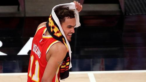 Trae Young (11) reacts after the win over the Washington Wizards in an NBA basketball game Wednesday, May 12, 2021, in Atlanta. Atlanta Hawks defeated the Washington Wizards 120-116.
