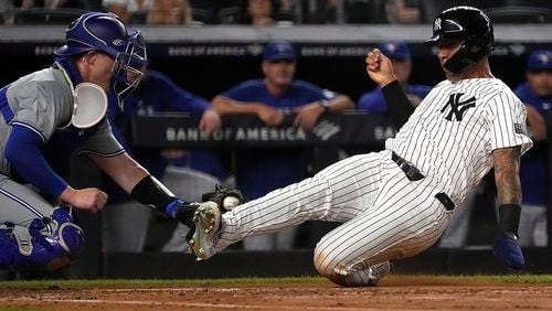 New York Yankees' Gleyber Torres, right, is tagged out at home plate by Toronto Blue Jays catcher Brian Serven, left, during the second inning of a baseball game, Friday, Aug. 2, 2024, in New York. (AP Photo/Pamela Smith)