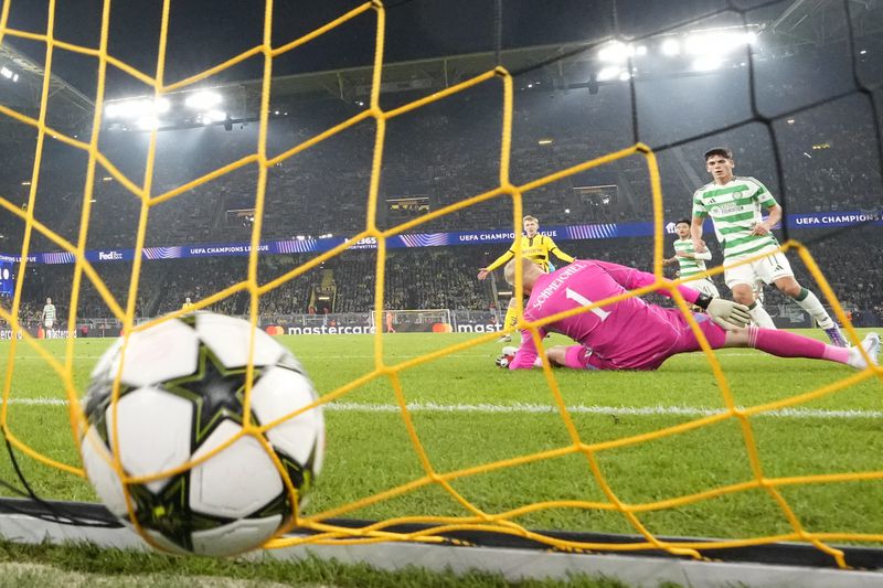 Celtic's goalkeeper Kasper Schmeichel receives the 6th goal by Dortmund's Serhou Guirassy during the Champions League opening phase soccer match between Borussia Dortmund and Celtic FC at the BVB Stadion in Dortmund, Tuesday, Oct. 1, 2024. (AP Photo/Martin Meissner)