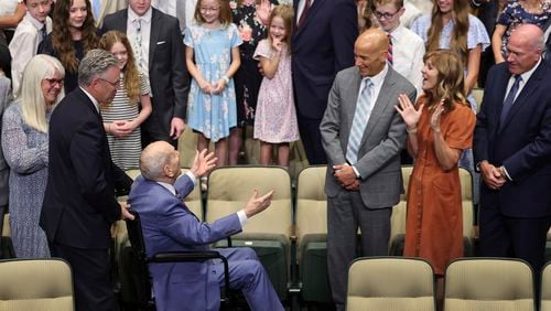 President Russell M. Nelson of The Church of Jesus Christ of Latter-day Saints greets his family prior to a photo during his 100th birthday celebration at the Little Theatre of the Conference Center in Salt Lake City, Monday, Sept. 9, 2024. (Jeffrey D. Allred/The Deseret News via AP, Pool)