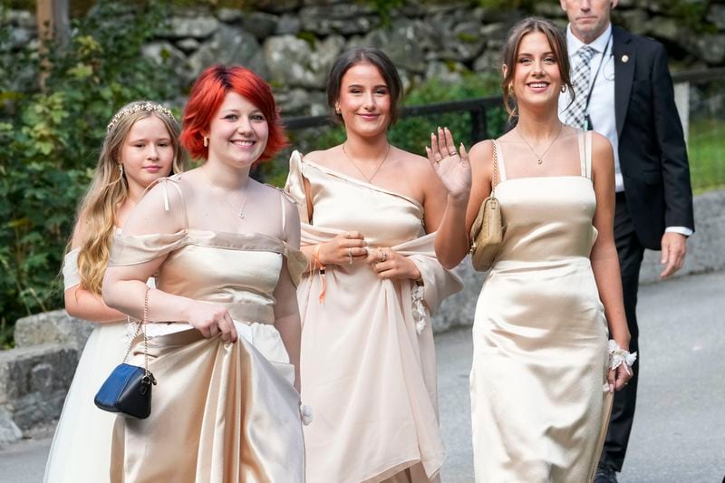 The daughters of Norway's Princess Martha Louise, Maud Angelica Behn, Emma Tallulah Behn and Leah Isadora Behn, in Geiranger, Norway, Saturday Aug. 31, 2024, during the wedding of Princess Martha Louise and Durek Verrett. (Cornelius Poppe/NTB via AP)