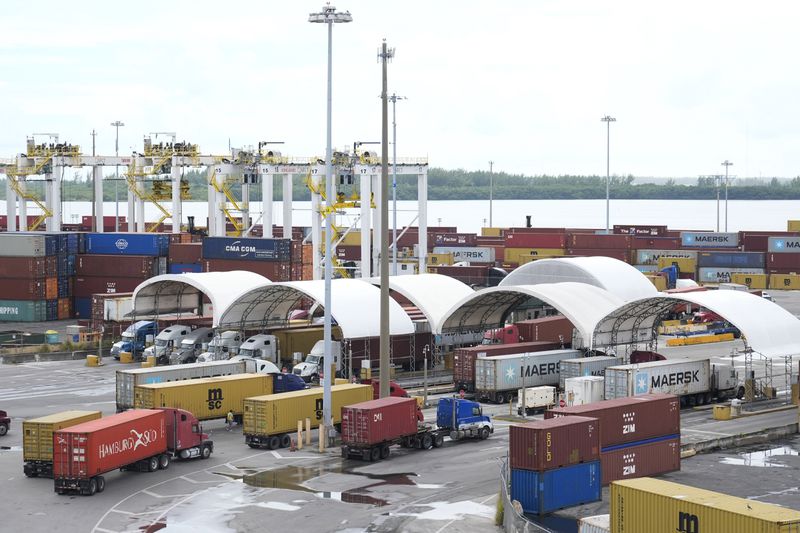 Dockworkers' union suspends strike until Jan. 15 to allow time to negotiate  new contract