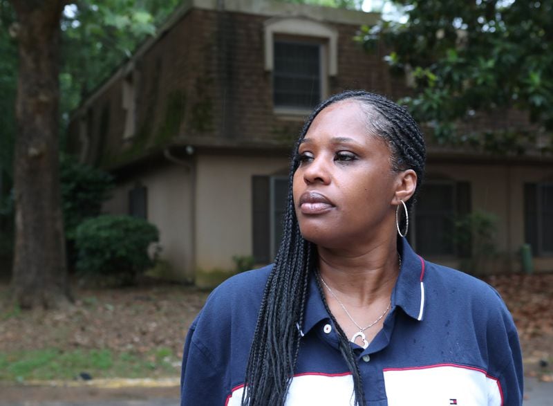 Griffin stands outside her apartment in Stonecrest. (Curtis Compton / ccompton@ajc.com)