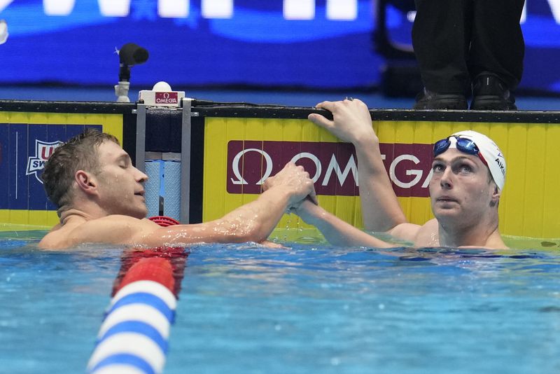 Jack Aikins and Ryan Murphy after a Men's 200 backstroke semifinal heat Wednesday, June 19, 2024, at the US Swimming Olympic Trials in Indianapolis. (AP Photo/Michael Conroy)