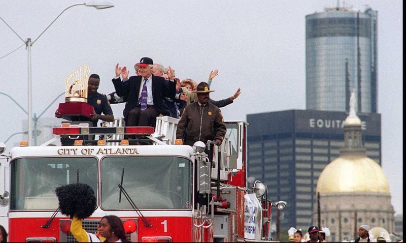 Atlanta Braves owner Ted Turner makes the symbolic tomahawk chop from a fire engine Monday, October 30, 1995, as the Braves victory parade passes the state Capitol. (AJC photo/Johnny Crawford)