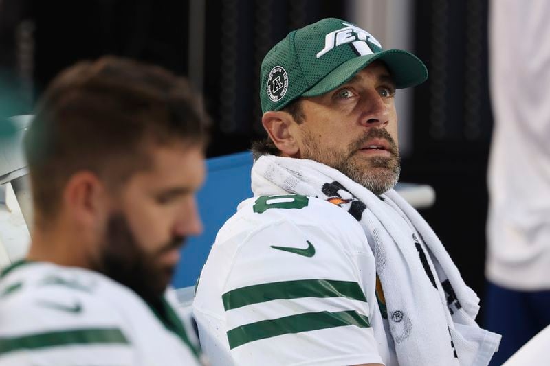 New York Jets quarterback Aaron Rodgers, right, sits on the bench during the second half of an NFL football game against the San Francisco 49ers in Santa Clara, Calif., Monday, Sept. 9, 2024. (AP Photo/Jed Jacobsohn)