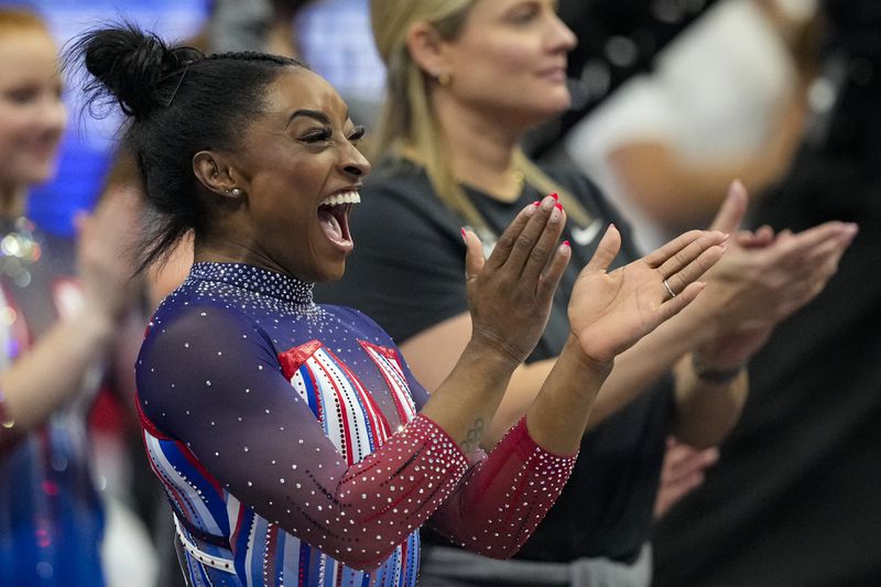 Simone Biles celebrates as day two of competition winds down at the United States Gymnastics Olympic Trials on Sunday, June 30, 2024, in Minneapolis. (AP Photo/Abbie Parr)