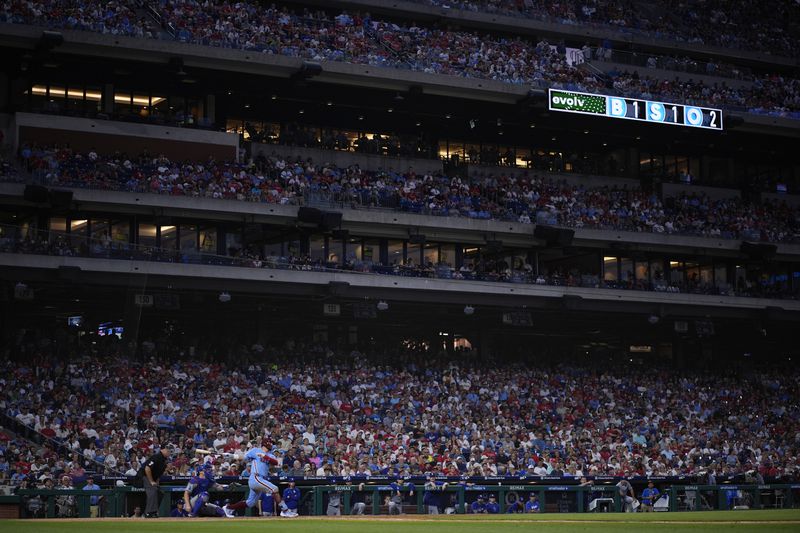 Philadelphia Phillies' Kyle Schwarber hits a home run against Los Angeles Dodgers pitcher Ryan Yarbrough during the eighth inning of a baseball game, Thursday, July 11, 2024, in Philadelphia. (AP Photo/Matt Slocum)