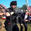 FILE - U.S. Secret Service agents respond as Republican presidential candidate former President Donald Trump is surrounded on stage by U.S. Secret Service agents at a campaign rally, July 13, 2024, in Butler, Pa. (AP Photo/Evan Vucci, File)